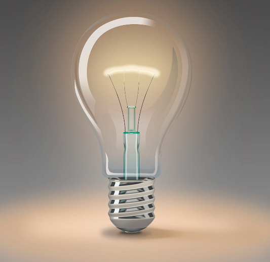 Close-up of a glowing incandescent light bulb representing the best light bulbs for home use