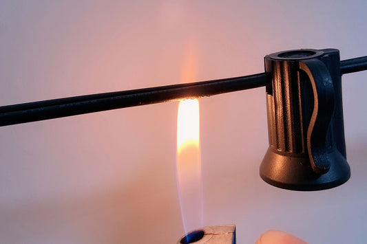 Testing best materials for fire-safe string lights with flame near black wire and plastic socket