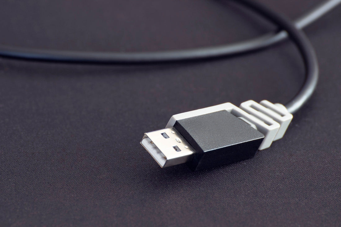 Close-up of a USB plug on a black cable showing USB-powered light strips benefits for easy power connection