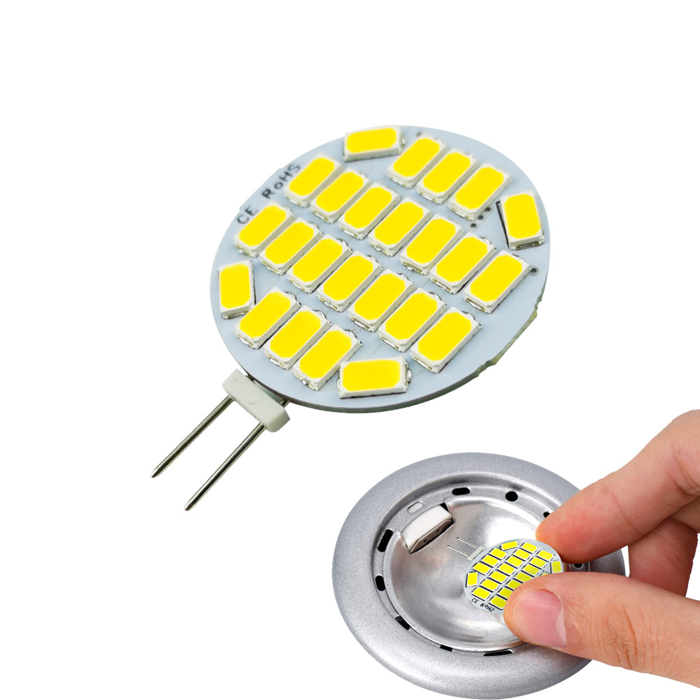 G4 LED Bulb for Range Hood with multiple yellow LED chips and two-pin base held near a metal fixture