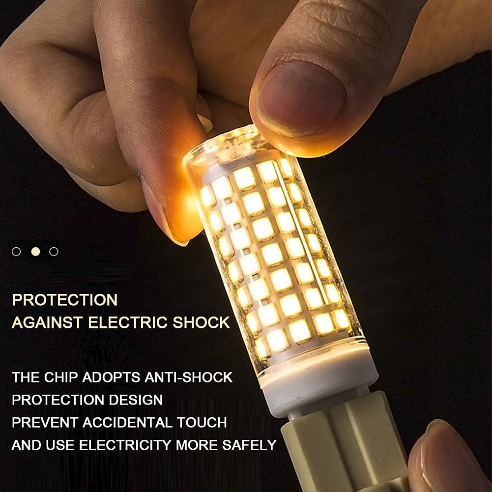 G9 LED bulb held between fingers glowing with anti-shock protection for safe use