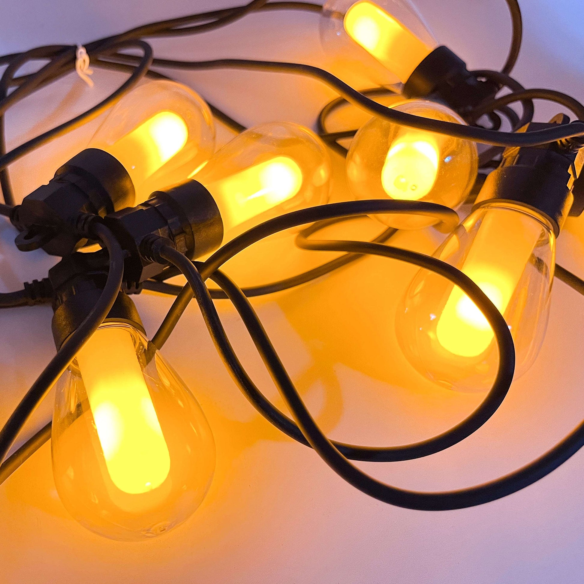 Warm yellow glowing fairy lights outdoor lighting with black wiring by Ningbo Fuaisi Electric Appliance