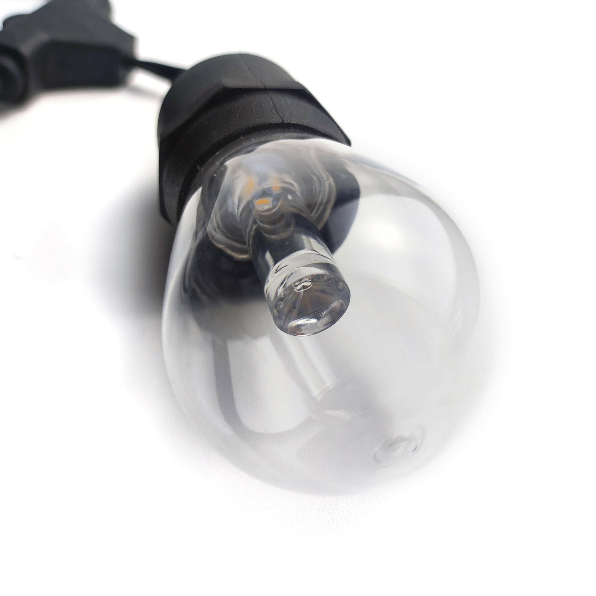 Close-up of smart outdoor string lights LED bulb with clear glass and black socket by Ningbo Fuaisi Electric Appliance