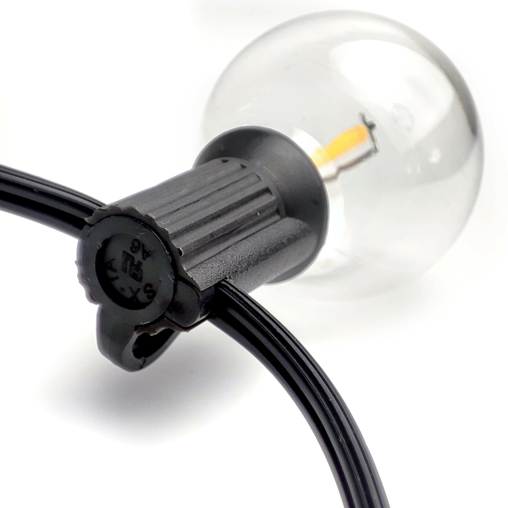 Close-up of solar led outdoor lighting bulb with black socket and clear glass design