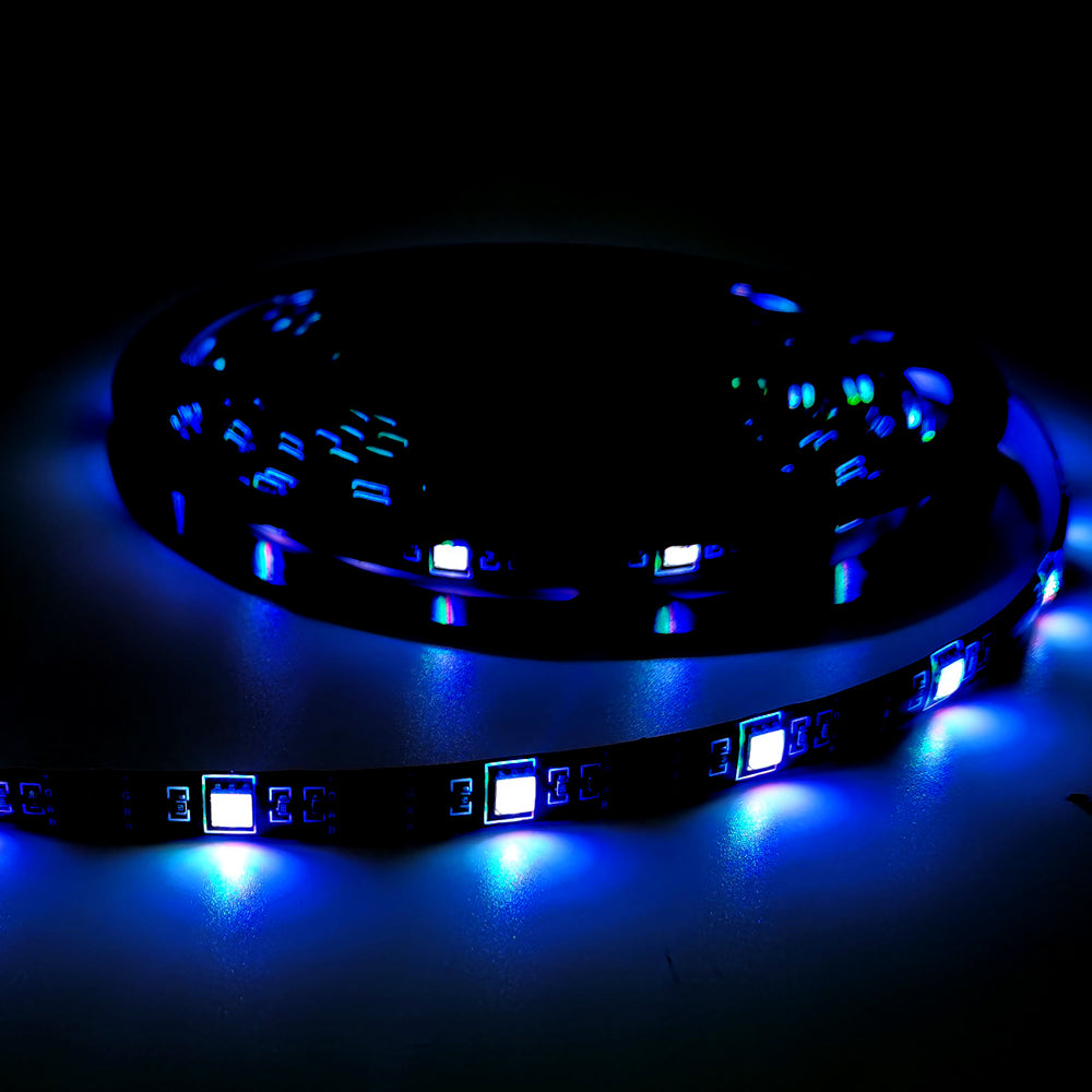 Blue glowing TV backlight LED strip rolled up with bright LED lights on dark background