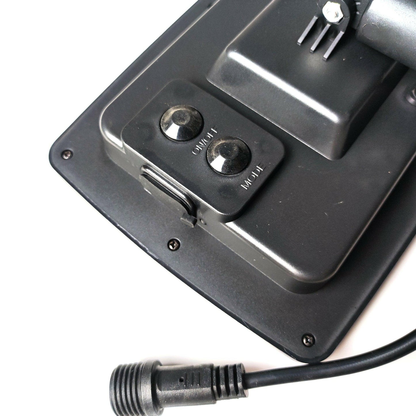 Close-up of black outdoor solar lights control panel with on off and high low switches and power cable