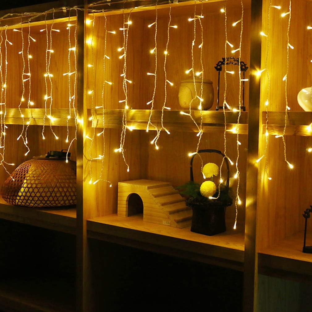 Warm white LED Fairy outdoor lighting hanging from wooden shelves providing cozy ambient light