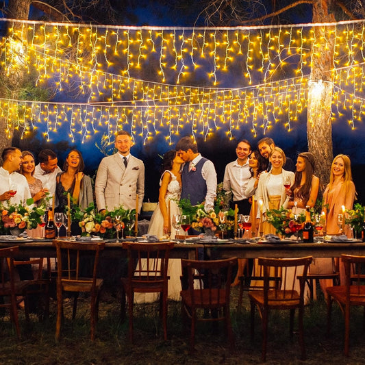 Outdoor wedding reception decorated with warm LED Fairy string lights creating a cozy ambiance
