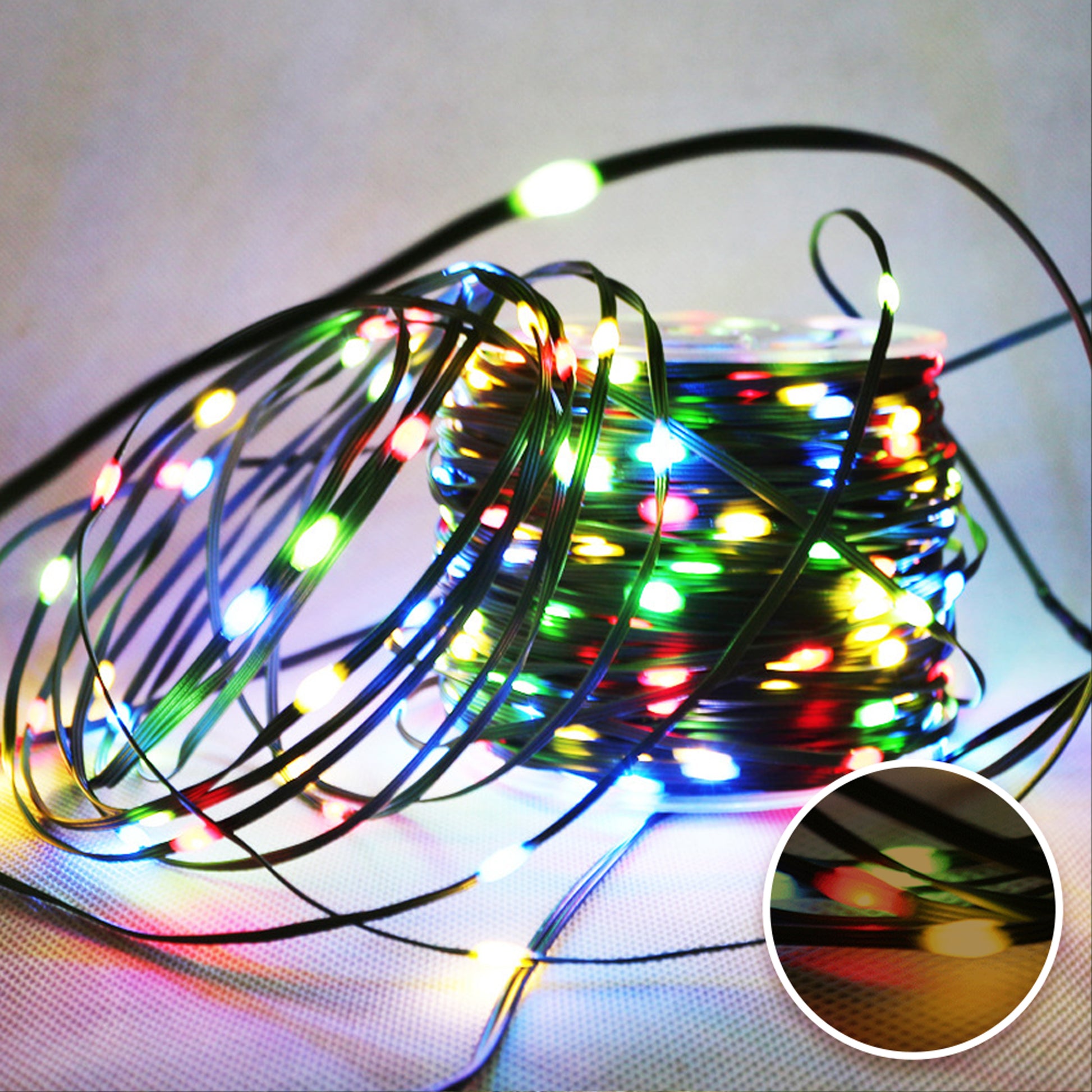 Colorful Festoon String Lights on a spool, perfect for outdoor events and celebrations