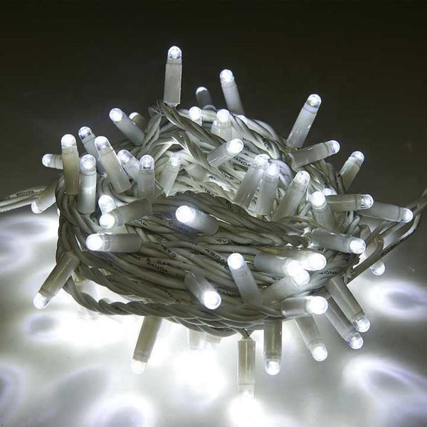 White waterproof string lights with bright LED bulbs twisted into a compact coil